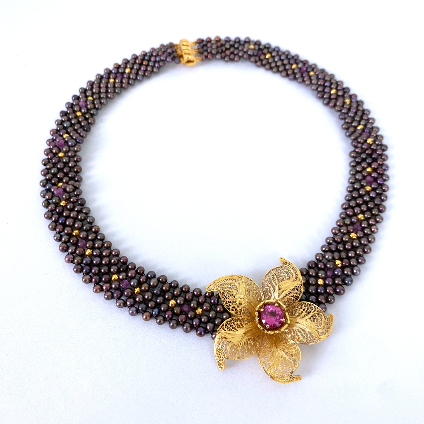 Woven Black Pearl Necklace with Pink Topaz & Golden Floral Centerpiece