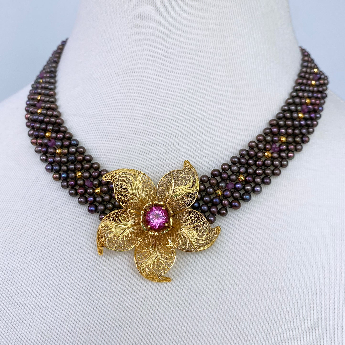 Woven Black Pearl Necklace with Pink Topaz & Golden Floral Centerpiece