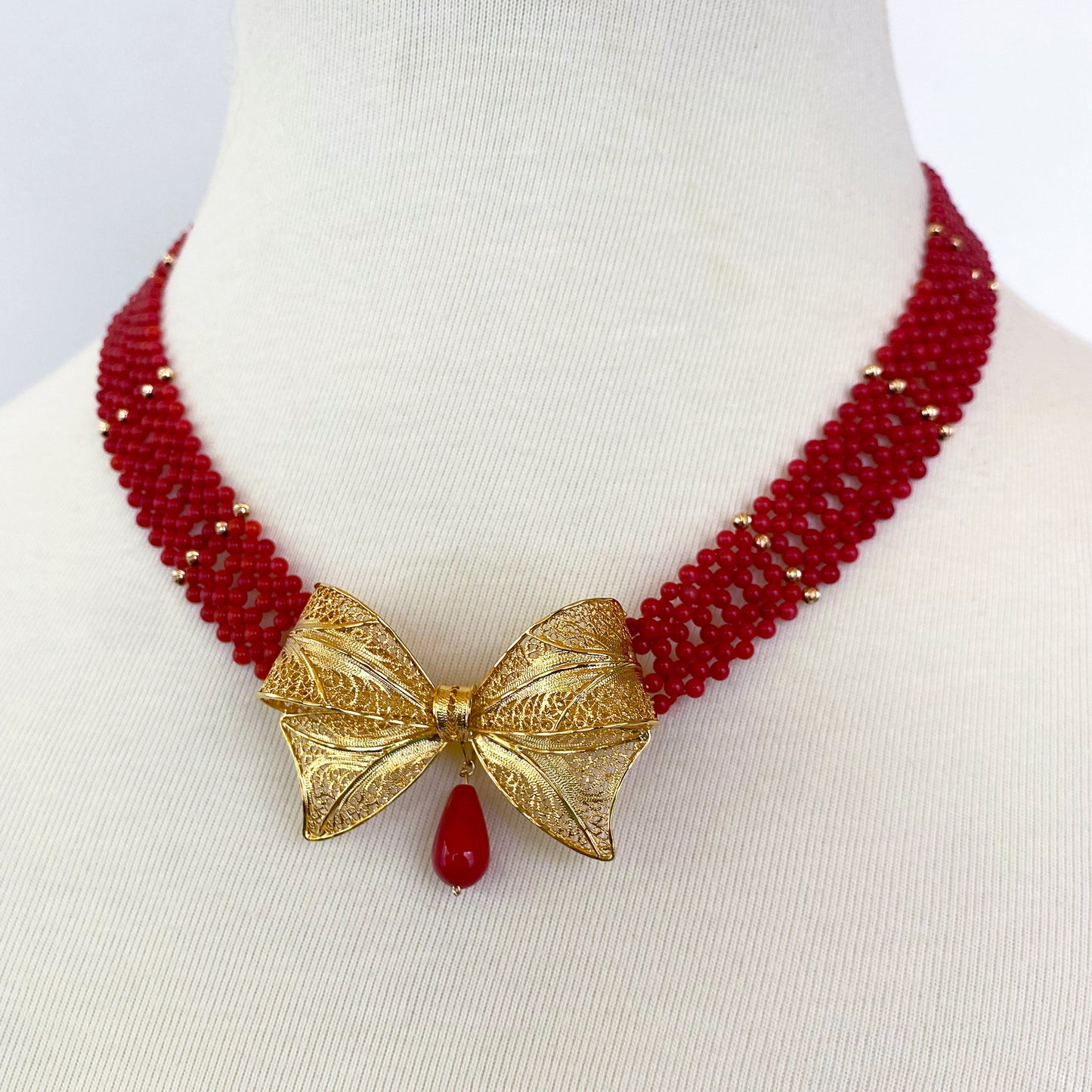 Coral Woven Necklace with 18k Plated Bowtie Centerpiece & Detailings