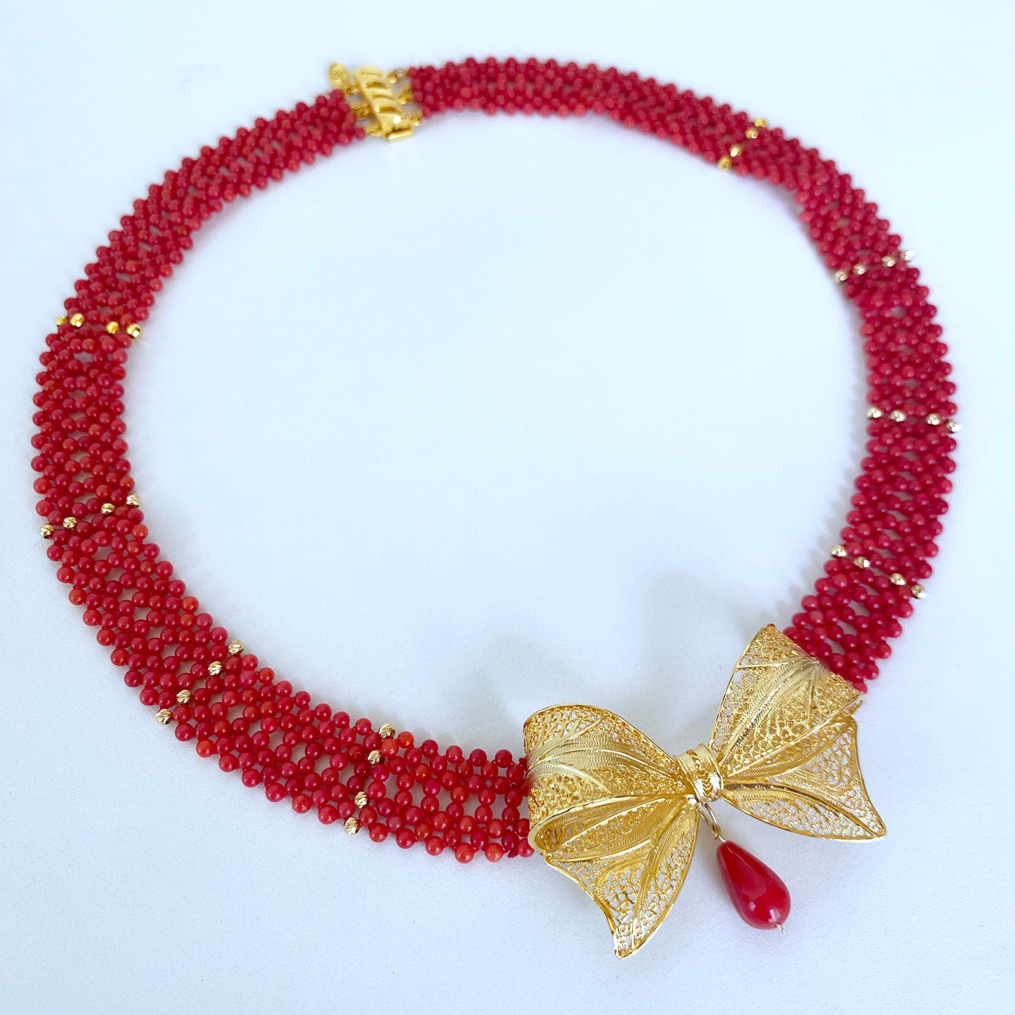 Coral Woven Necklace with 18k Plated Bowtie Centerpiece & Detailings
