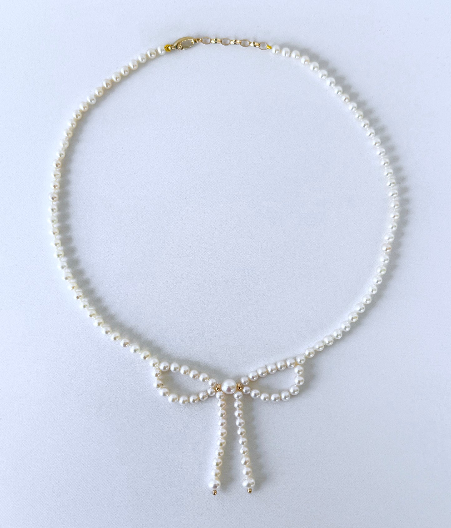 Pearl & Solid 14k Yellow Gold Accented Bow Necklace