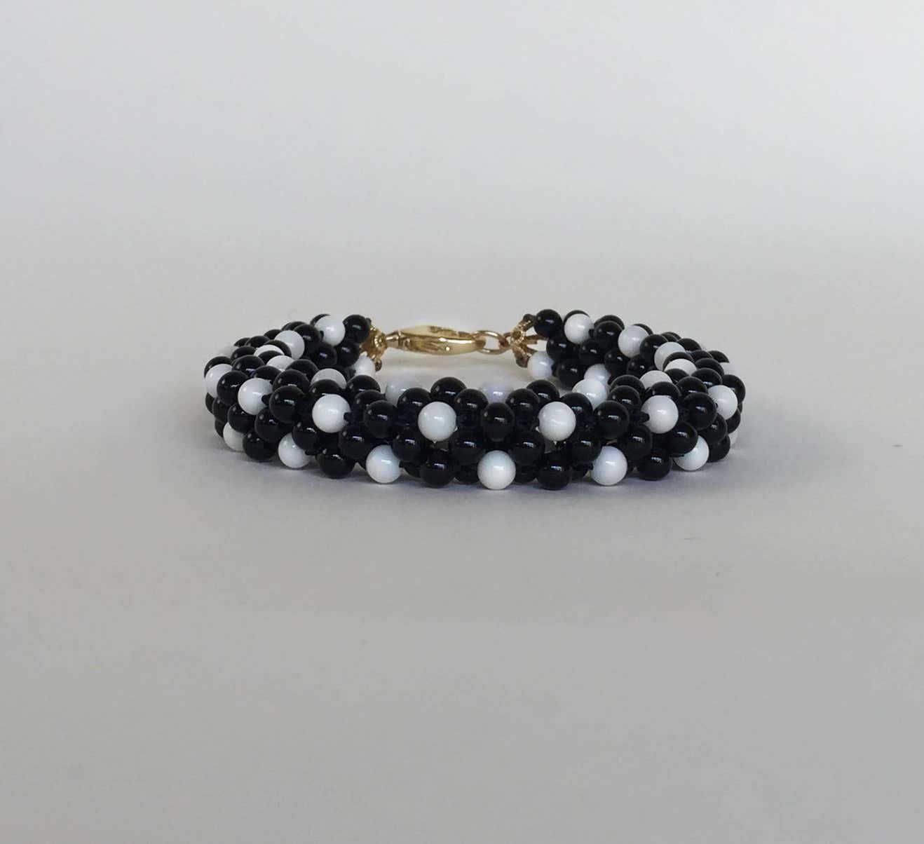 Onyx and White Coral and 14 Karat Yellow Gold Clasp Rope Bracelet