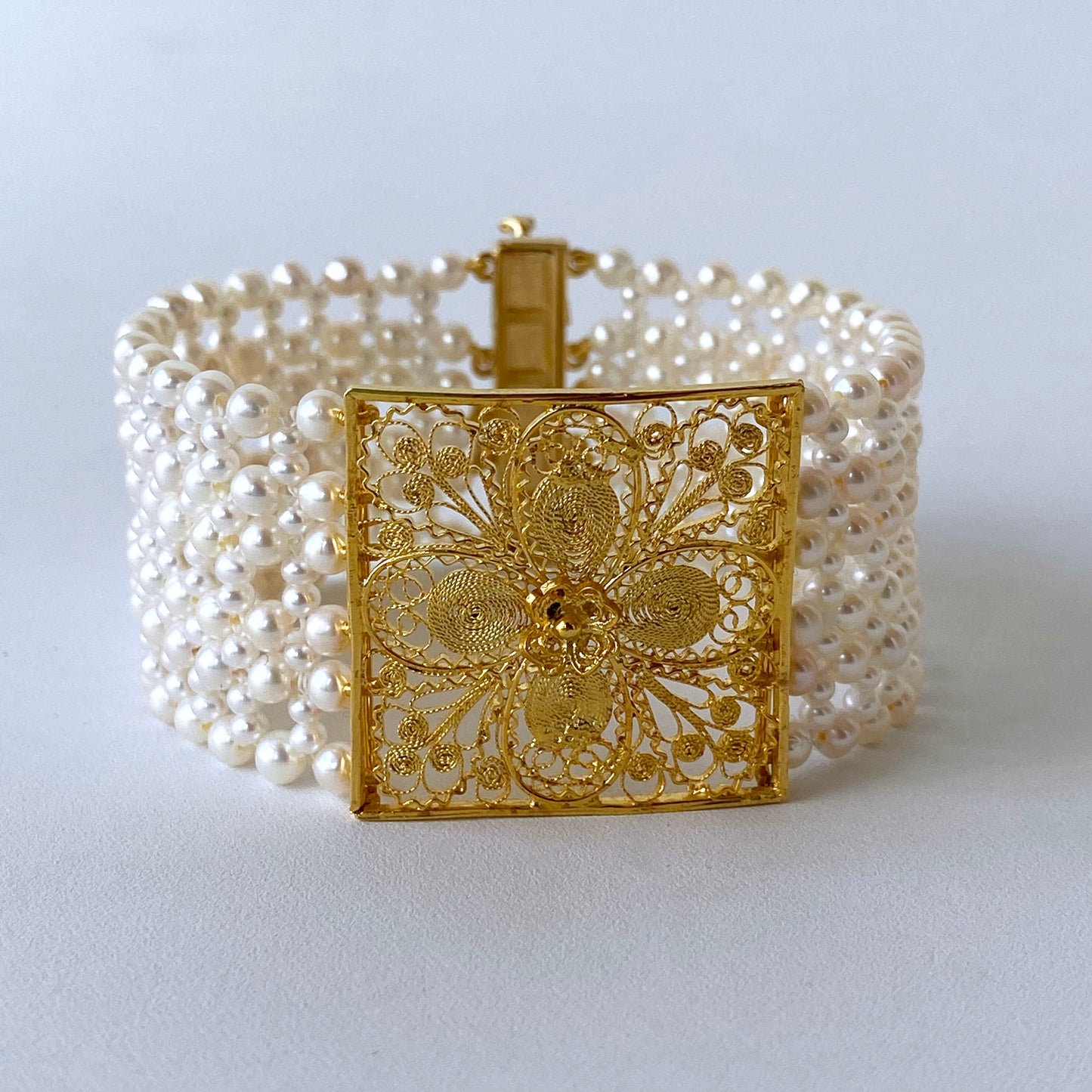 Woven Pearl Bracelet with 18k Yellow Gold Floral Centerpiece & Clasp