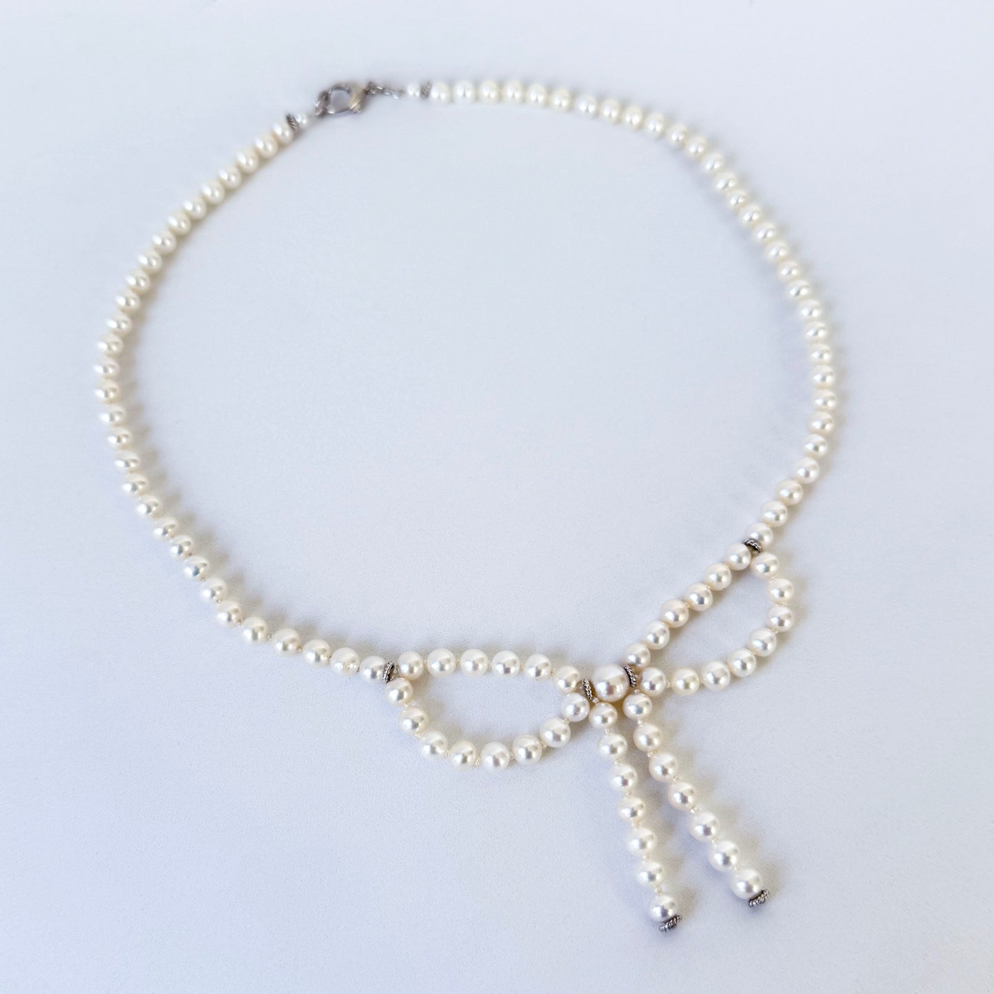 Pearl Necklace with Bow Centerpiece & Rhodium Clasp