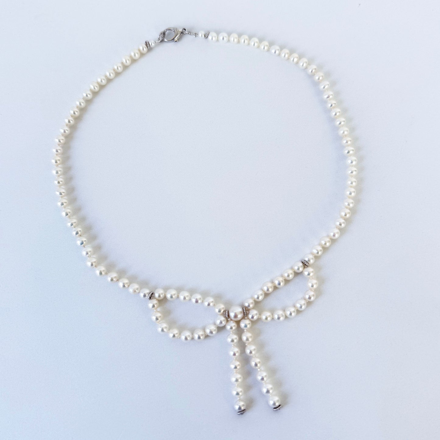 Pearl Necklace with Bow Centerpiece & Rhodium Clasp