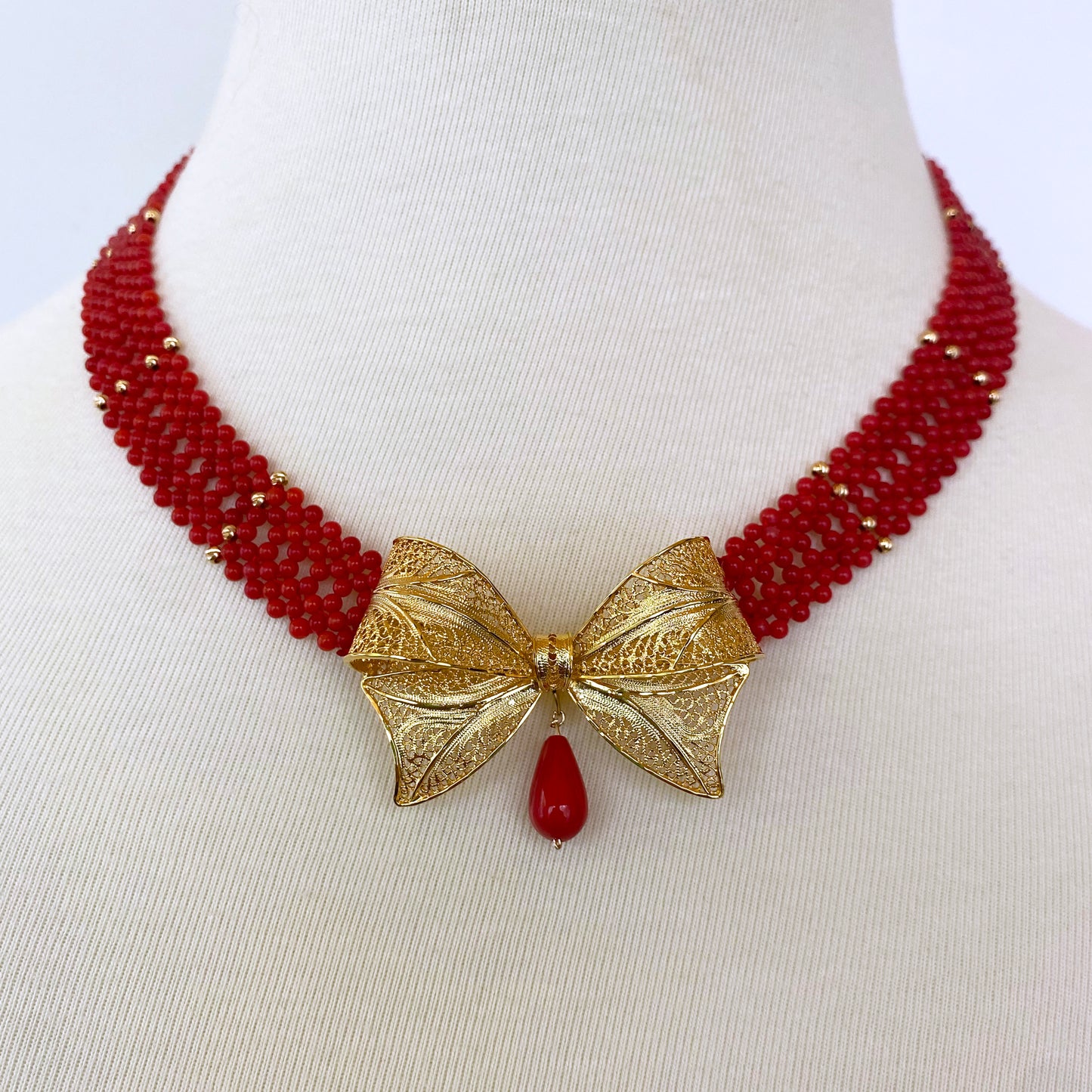 Coral Woven Necklace with 18k Plated Bowtie Centerpiece & Detailings