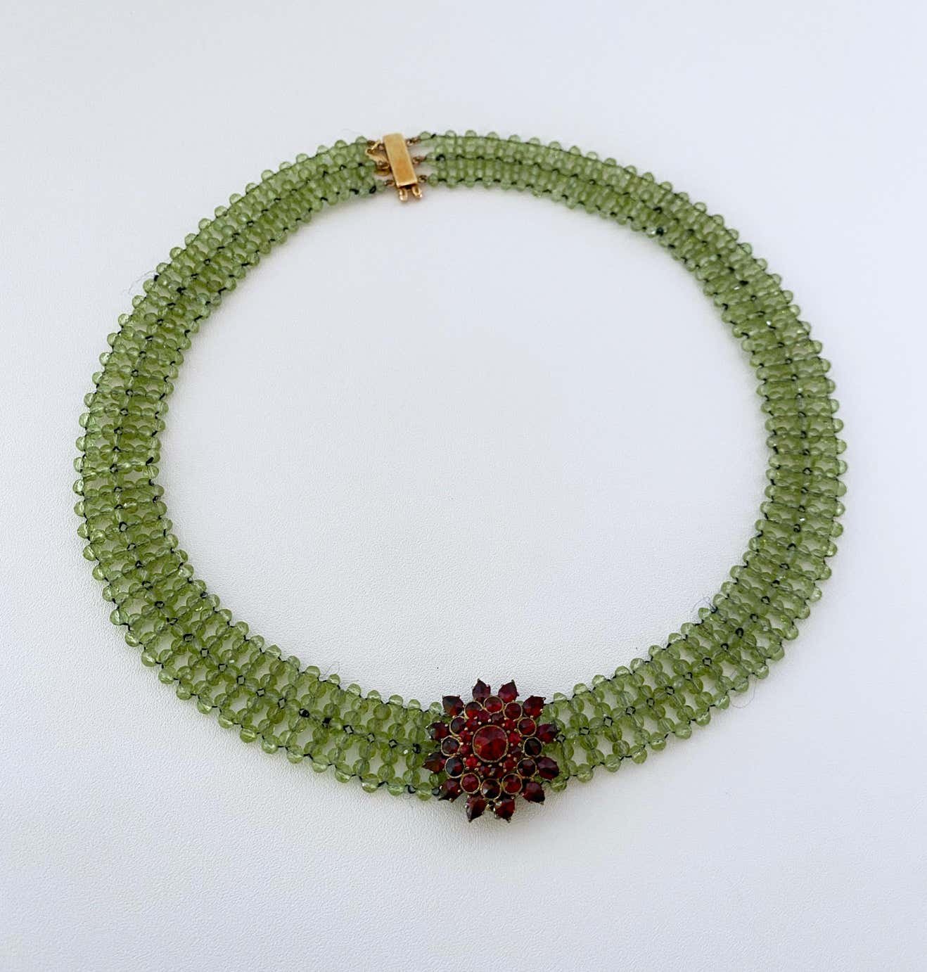 Woven Peridot Necklace with 14K Yellow Gold Clasp & Garnet Brooch