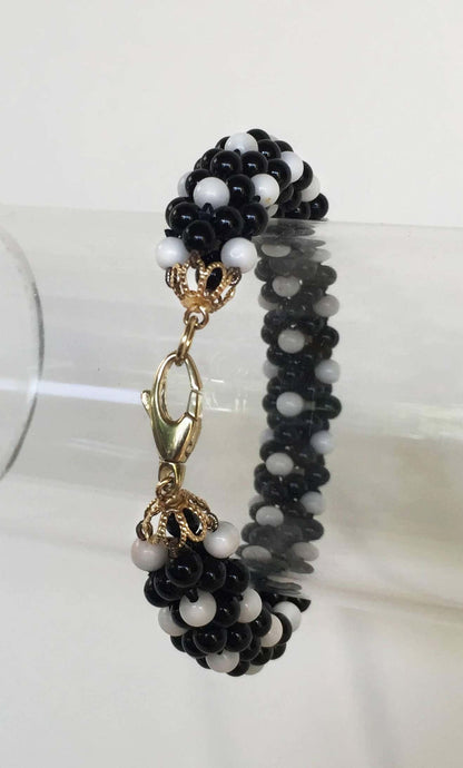 Onyx and White Coral and 14 Karat Yellow Gold Clasp Rope Bracelet